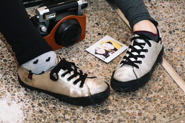 A close-up shot of a limited edition sneaker resulting from a streetwear collaboration, highlighting the intricate details, unique design elements, and premium materials used. The background is blurred to emphasize the sneaker.