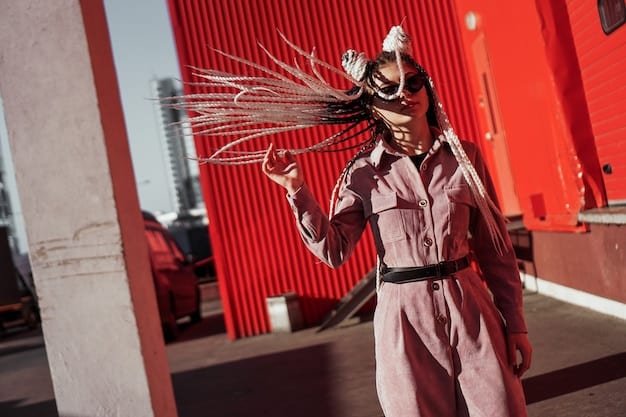 A model wearing a collaborative apparel piece on the streets of a trendy urban district. The apparel shows unique design elements that merge utility and urban fashion.