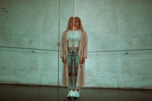 A person with an hourglass figure wearing a fitted streetwear outfit with a cropped hoodie and high-waisted pants. The colors are muted and the background is a minimalist urban setting.
