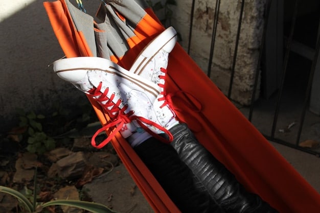 A close-up shot of a pair of highly coveted Off-White x Nike sneakers, highlighting the deconstructed design and iconic zip-tie detail. The image emphasizes the shoe's limited-edition status and its appeal to collectors and sneakerheads.