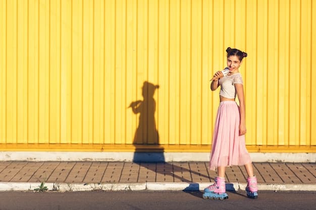 A full shot of a woman walking down a city street, wearing pastel-colored streetwear. She has on an oversized lilac blazer, a mint green crop top, and light pink cargo pants, complemented with white sneakers and a baby blue backpack.