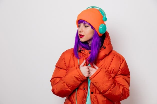 A woman wearing a bright purple puffer jacket with a high collar and a detachable hood, paired with black leggings, chunky snow boots, and reflective sunglasses. She is walking through a snow-covered urban park, showcasing a fashionable and functional winter look.