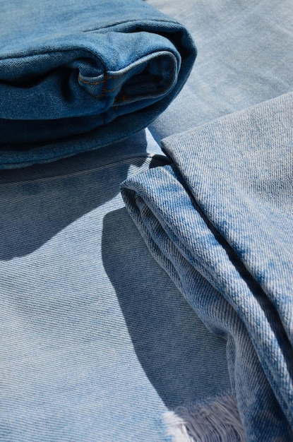 A close-up showcasing various sustainable fabrics, including recycled denim, organic cotton, and innovative materials made from pineapple leaves and seaweed. The fabrics are textured and visually appealing, highlighting the potential for eco-friendly fashion.