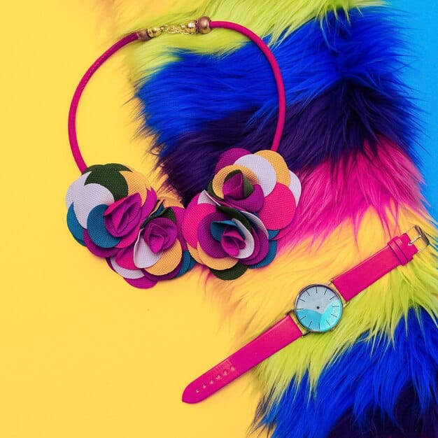 Close-up shot of various urban-style accessories, including a statement necklace, a trendy watch, and a colorful scarf. The accessories are stylish and reflect different personality types.