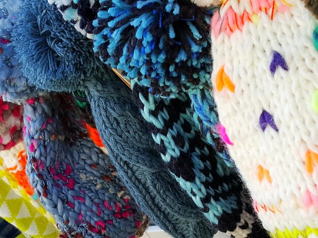 Close-up shot of various fabric swatches showcasing different print categories: geometric, floral, animal, and abstract. The image emphasizes the textures and patterns, illustrating the diversity of prints available for mixing and matching.