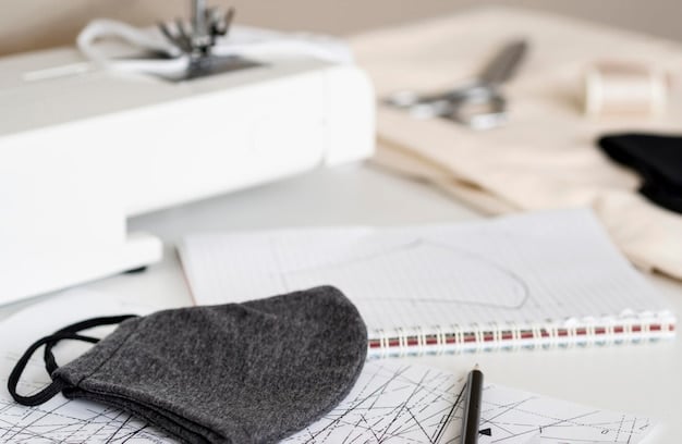 A close-up of a modern, minimalist workspace with fashion sketches of classic silhouettes, fabric swatches, and a mood board featuring urban street style photography.