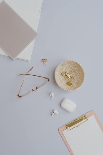 A selection of accessories laid out on a minimalist surface, including a simple gold necklace, silver hoop earrings, a black leather belt, a classic wristwatch, and a pair of sunglasses. The accessories are timeless and versatile, suitable for various outfits.
