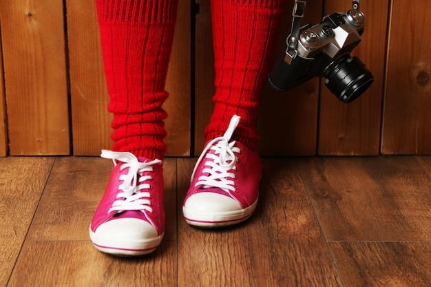 Close-up shot of a person's feet wearing high-end, limited edition sneakers, highlighting the unique textures and design elements discussed within sneaker terminology.