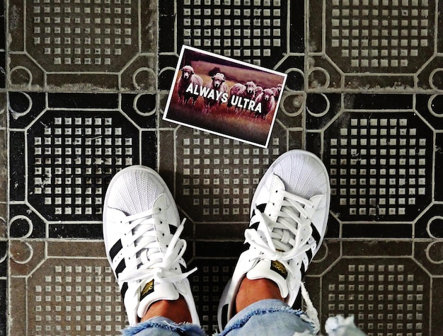 A split image showing an authentic sneaker's internal size tag with crisp, correct font and alignment, alongside a fake tag with blurry print and slightly off-kilter text.