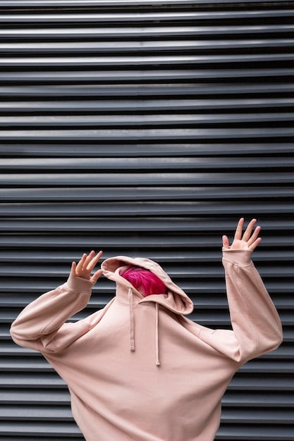 A dynamic flat lay of various streetwear items, including a limited-edition hoodie, a graphic tee, and a pair of rare accessories, arranged neatly against a modern, textured background.